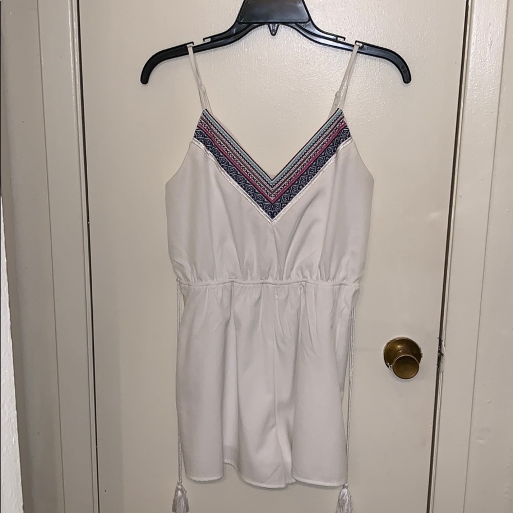 White romper with tassels